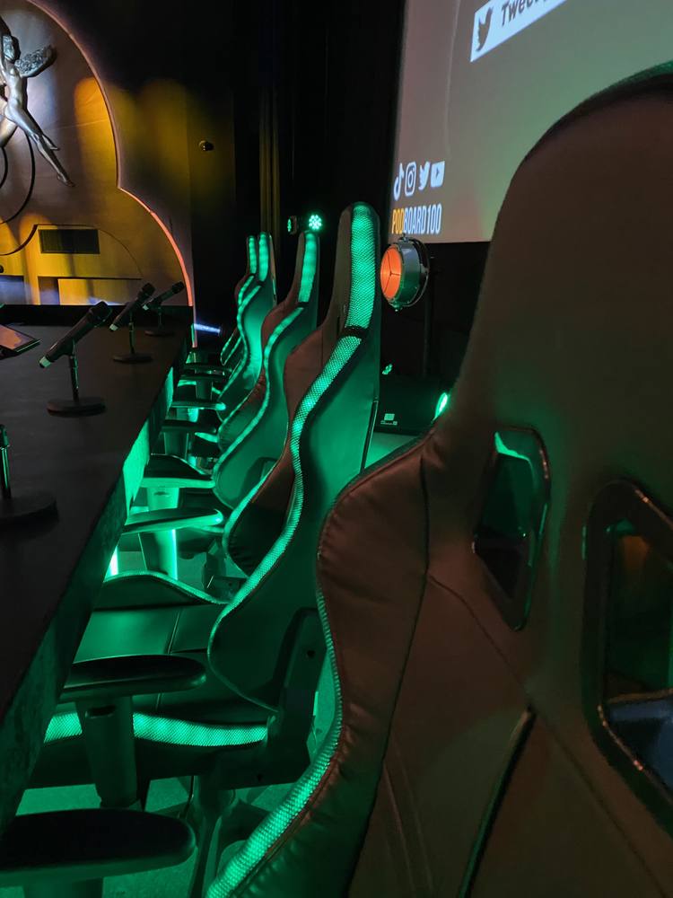 Live event seating with green lighting