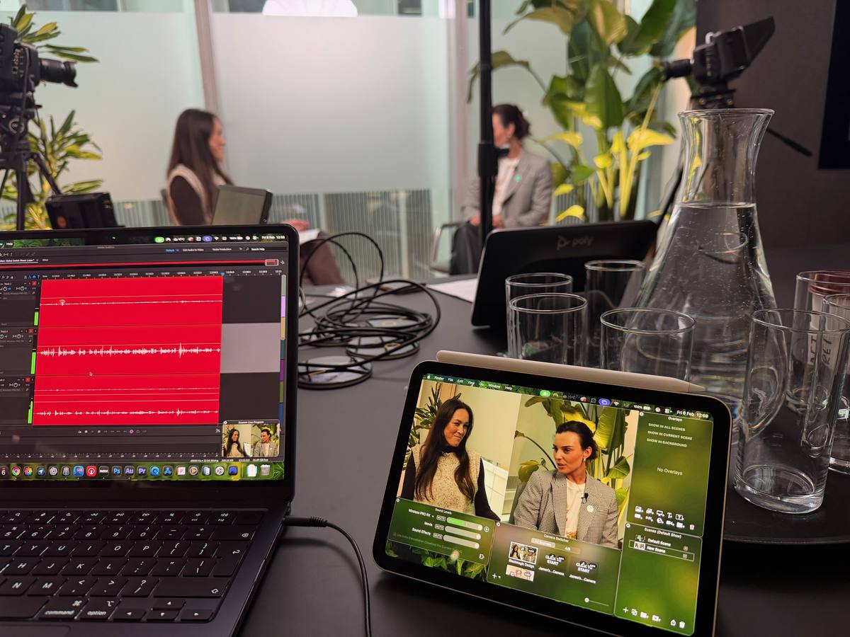 Laptop and tablet editing a podcast on location